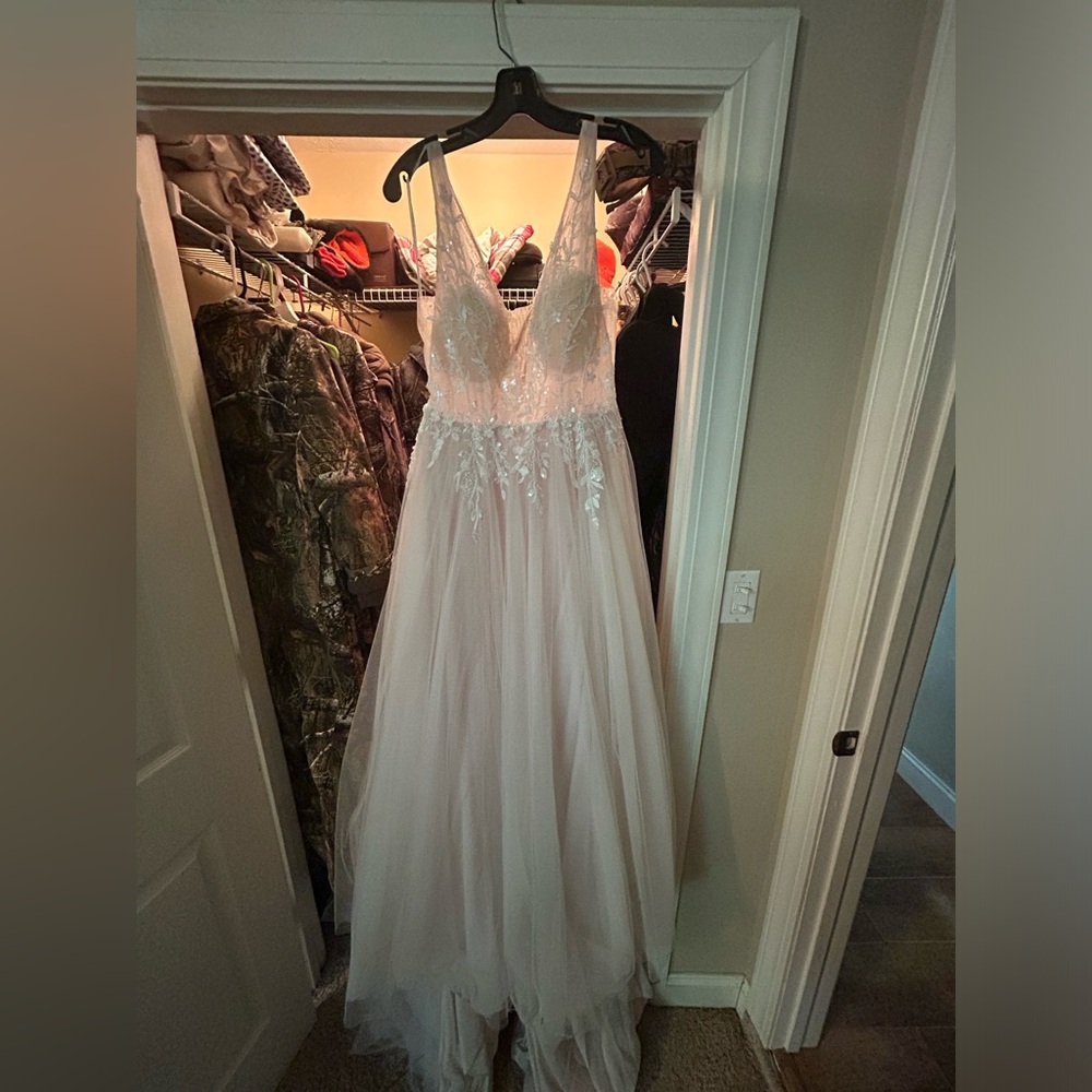 Wedding dress white one paid $2800 I think it was a 10 taken up to an 8
